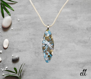 Fused Glass Blue Turquoise Brown and Vanilla Glass Long Oval Pendant with White Dragonfly Decal Fused Glass Blue Turquoise Brown and Vanilla Glass Long Oval Pendant with White Dragonfly Decal