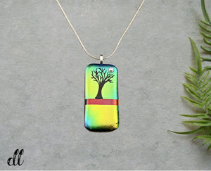 Dichroic Gold Green Blue Glass Rectangular Pendant with Hand Etched Tree of Life with a Swarovski Crystal Moon Dichroic Gold Green Blue Glass Rectangular Pendant with Hand Etched Tree of Life with a Swarovski Crystal Moon