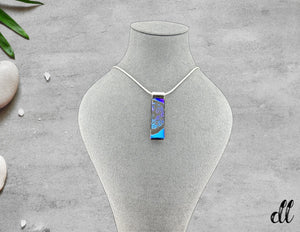 Fused Glass Blue Purple Dichroic Long Rectangular Pendant Etched with Mandala Designs on a Black base Fused Glass Blue Purple Dichroic Long Rectangular Pendant Etched with Mandala Designs on a Black base