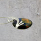 Dichroic Fused Glass Black Blue Orange Gold Round Pendant in a Gorgeous Silver Setting