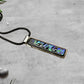 Fused Glass Pink Blue Purple Green Dichroic Long Rectangular Pendant Etched with Mandala Designs on a Black/Clear base